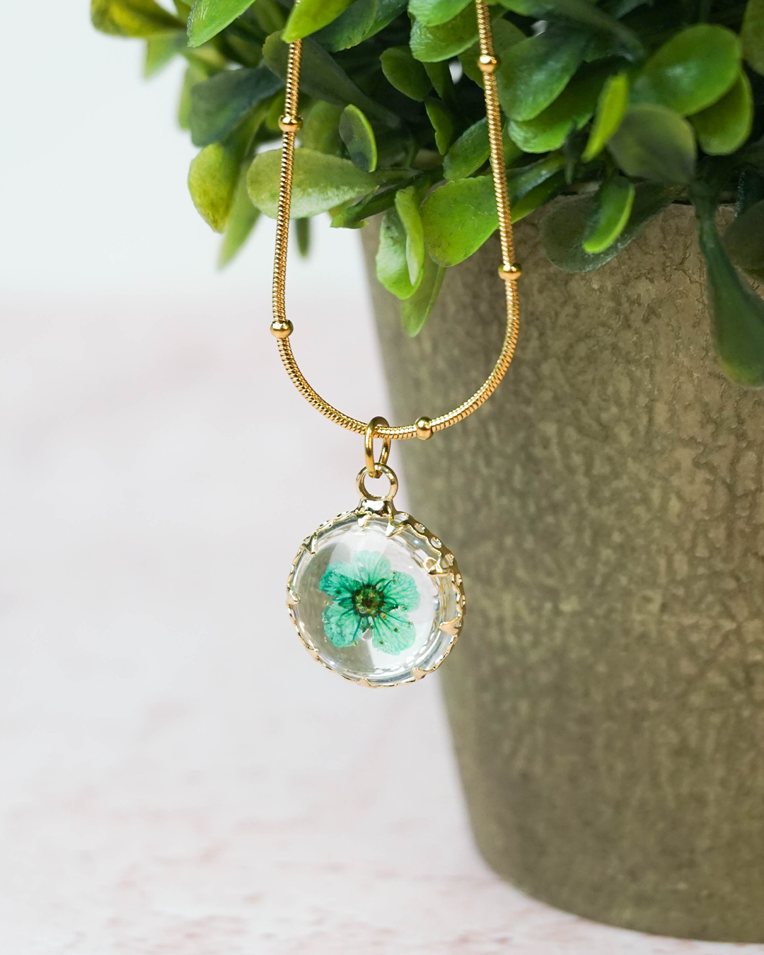 Collar Flor encapsulada turquesa
