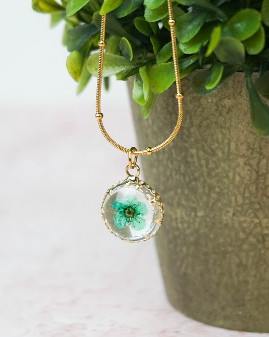 Collar Flor encapsulada turquesa