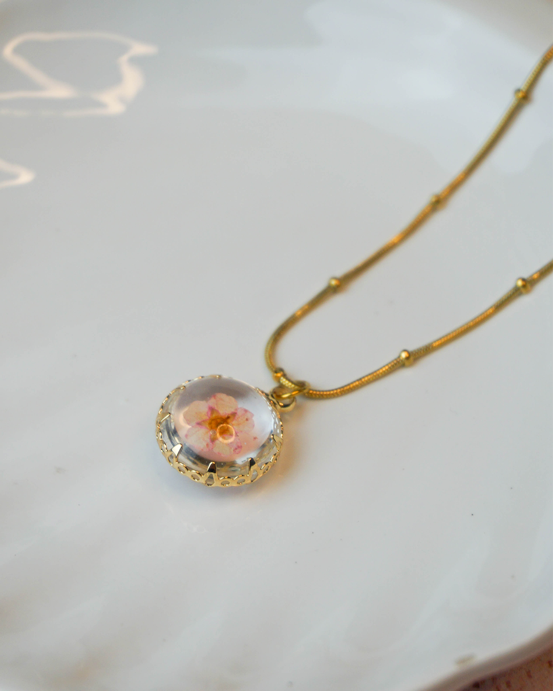 Collar flor encapsulada rosa